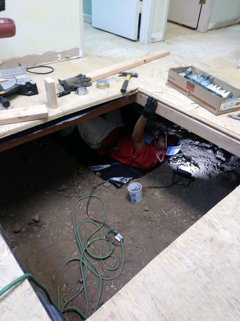 Repairing sagging sub-floor before installing new vinyl plank flooring.